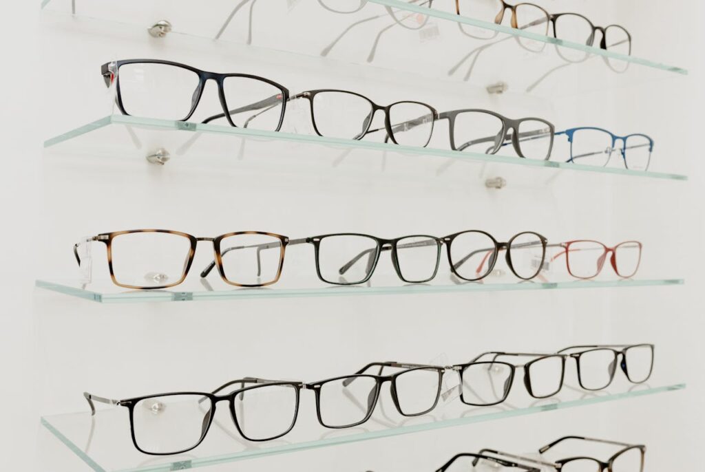 Collection of eyeglasses on shelves in store